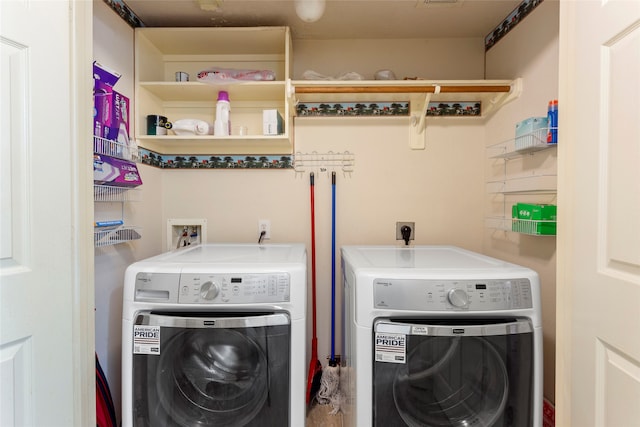 washroom with washer and dryer