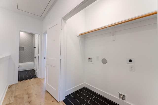 washroom featuring washer hookup, hookup for a gas dryer, hookup for an electric dryer, and light wood-type flooring