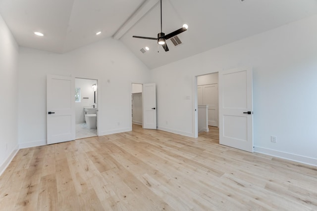 unfurnished bedroom featuring ceiling fan, ensuite bath, beam ceiling, light hardwood / wood-style flooring, and high vaulted ceiling