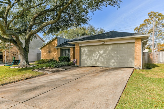 single story home with a garage and a front lawn