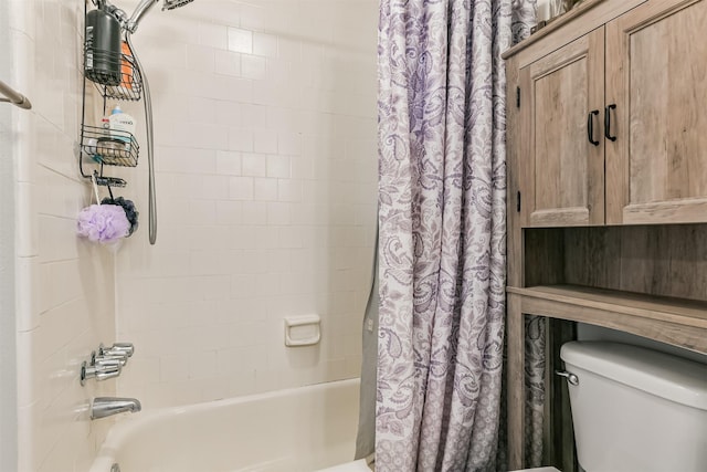 bathroom featuring toilet and shower / bath combination with curtain