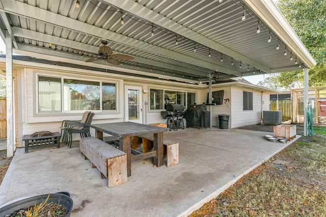 view of patio / terrace with ceiling fan, a grill, and central AC