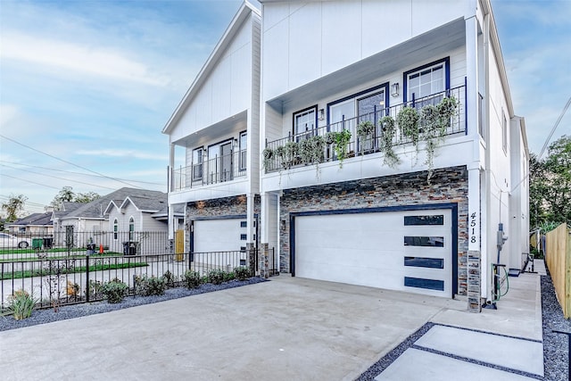 view of front facade featuring a balcony and a garage