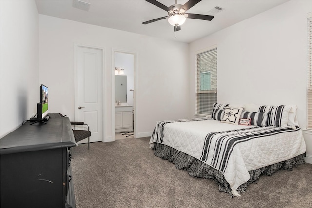 bedroom featuring ceiling fan, carpet floors, and ensuite bath