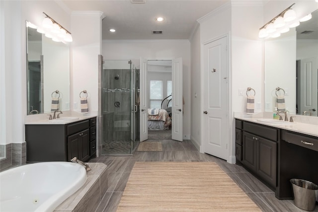 bathroom featuring independent shower and bath, crown molding, and vanity