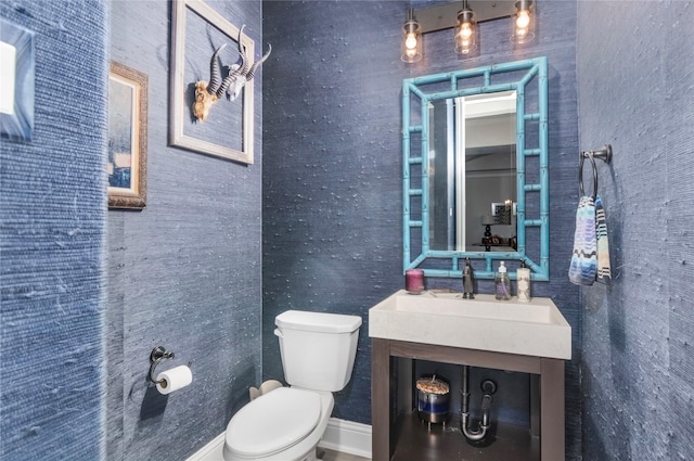 bathroom with toilet and vanity