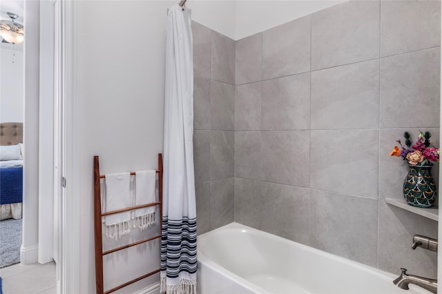 bathroom featuring tile patterned floors and shower / bathtub combination with curtain