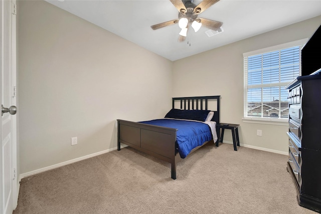 bedroom featuring ceiling fan and light colored carpet