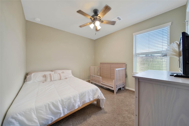 carpeted bedroom with ceiling fan