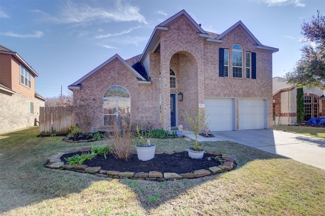 view of front property featuring a garage and a front yard