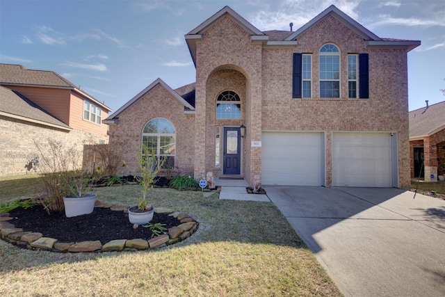 front of property featuring a front yard and a garage