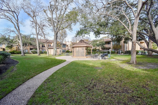 view of property's community featuring a gazebo and a lawn