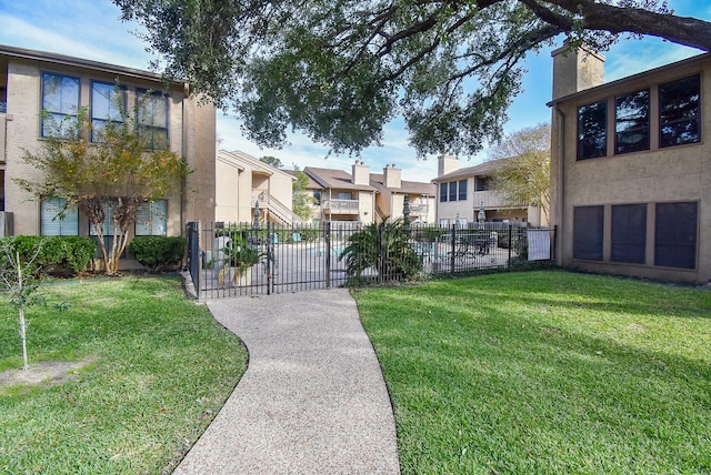 view of property's community featuring a lawn