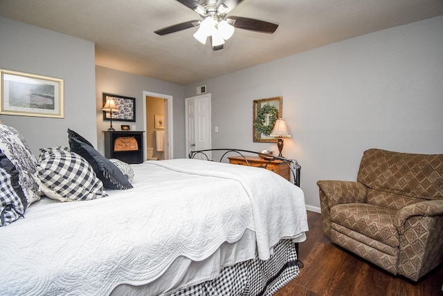 bedroom featuring dark wood-type flooring and ceiling fan