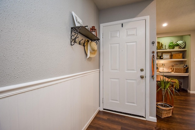 doorway to outside featuring dark wood-type flooring