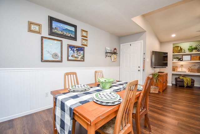 dining room featuring dark hardwood / wood-style flooring and built in shelves