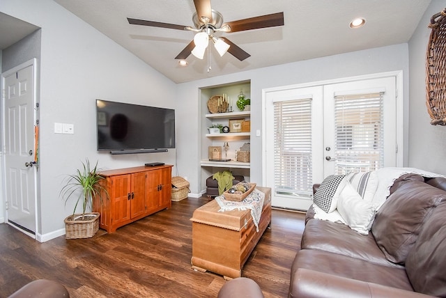 living room featuring ceiling fan, dark hardwood / wood-style flooring, lofted ceiling, french doors, and built in shelves