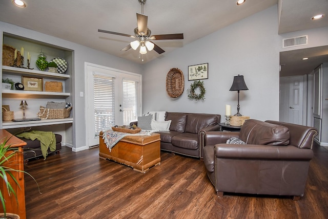 living room featuring dark wood-type flooring, ceiling fan, lofted ceiling, and built in shelves