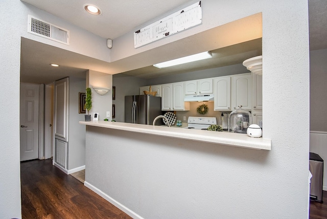 kitchen with kitchen peninsula, electric range, stainless steel refrigerator, white cabinets, and dark hardwood / wood-style flooring