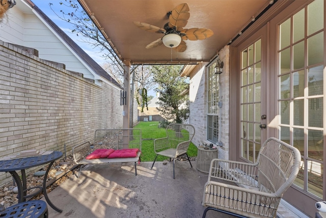 view of patio with ceiling fan and central AC unit