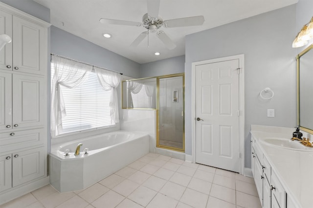 bathroom featuring ceiling fan, vanity, tile patterned floors, and shower with separate bathtub