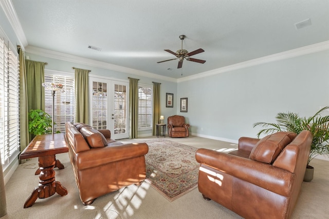 carpeted living room featuring french doors, plenty of natural light, and crown molding