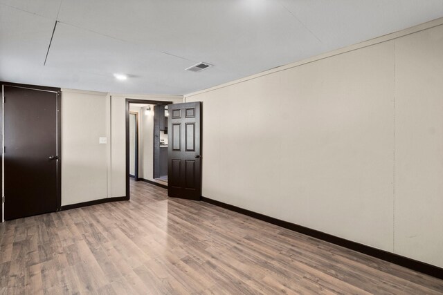 unfurnished room featuring hardwood / wood-style flooring