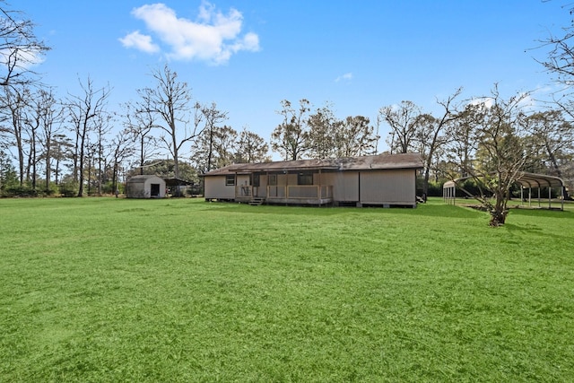 view of yard with a shed and a carport