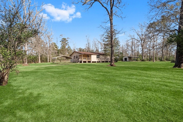 view of yard with a carport