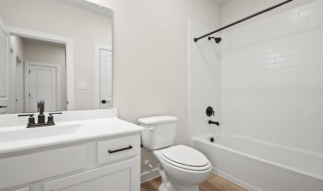 full bathroom featuring toilet, vanity, wood-type flooring, and shower / tub combination