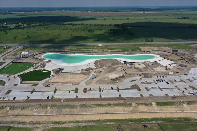 view of swimming pool featuring a rural view