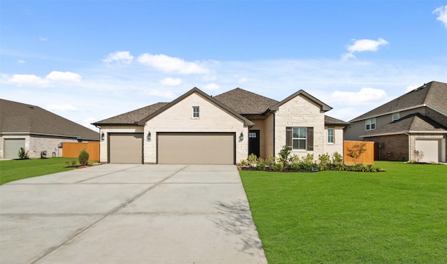 view of front of property with a garage and a front lawn