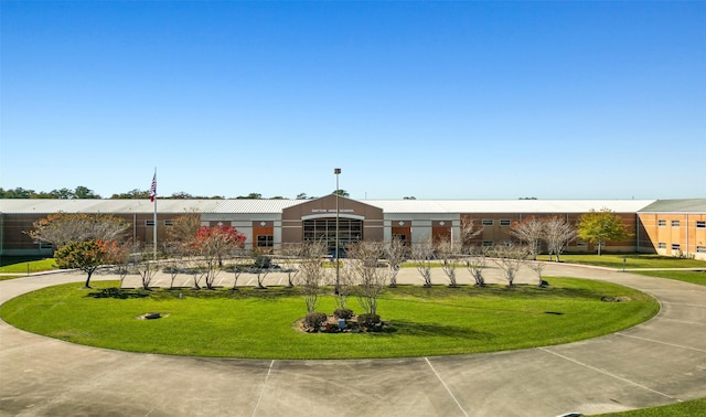 view of community featuring a lawn