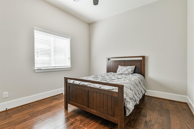 bedroom featuring ceiling fan, wood-type flooring, and lofted ceiling