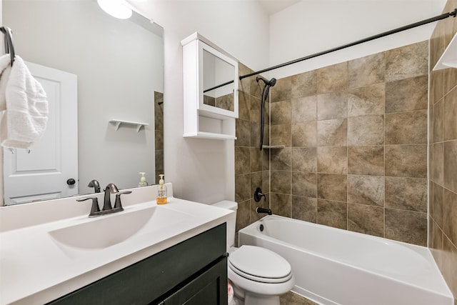 full bathroom featuring toilet, vanity, and tiled shower / bath