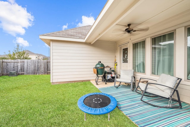 view of patio featuring ceiling fan