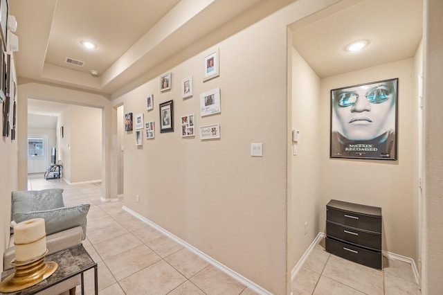 hall featuring light tile patterned flooring