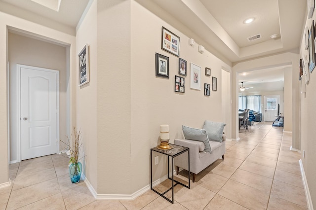 hallway with light tile patterned floors