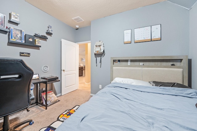 carpeted bedroom with a textured ceiling