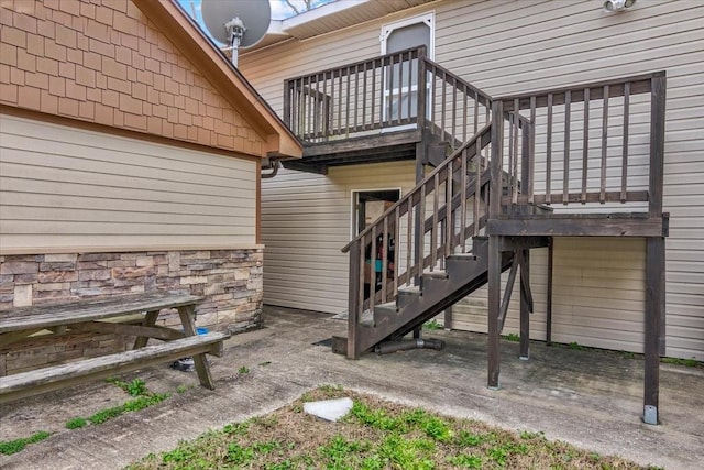 view of side of home with a balcony