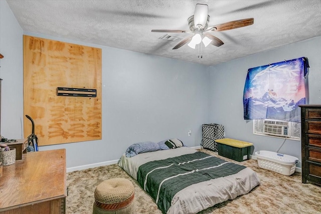 carpeted bedroom featuring a textured ceiling and ceiling fan