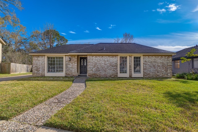 ranch-style home with a front yard