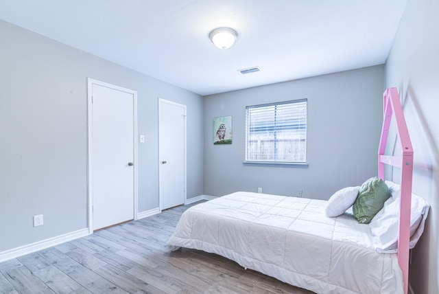 bedroom featuring light wood-type flooring