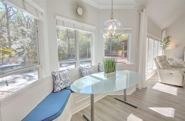 sunroom featuring a chandelier