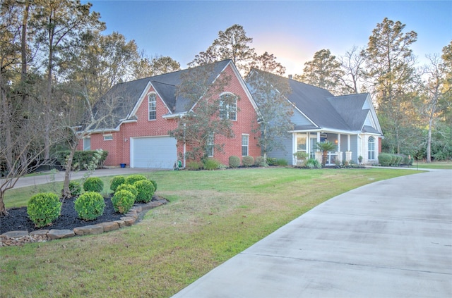 view of front facade featuring a lawn and a garage