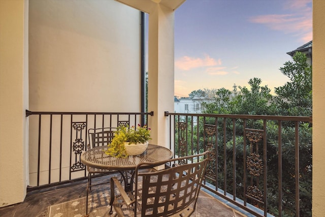 view of balcony at dusk