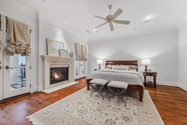 bedroom featuring ceiling fan, access to exterior, dark wood-type flooring, and crown molding