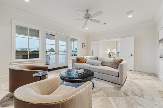 living room featuring ceiling fan, ornamental molding, and french doors