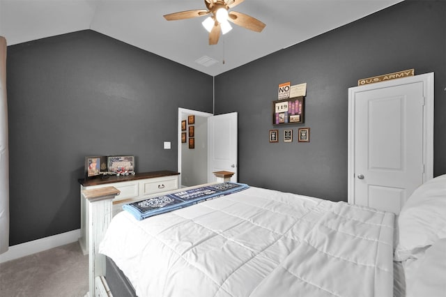 carpeted bedroom featuring ceiling fan and vaulted ceiling