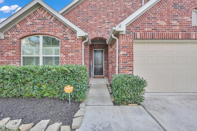 property entrance with a garage